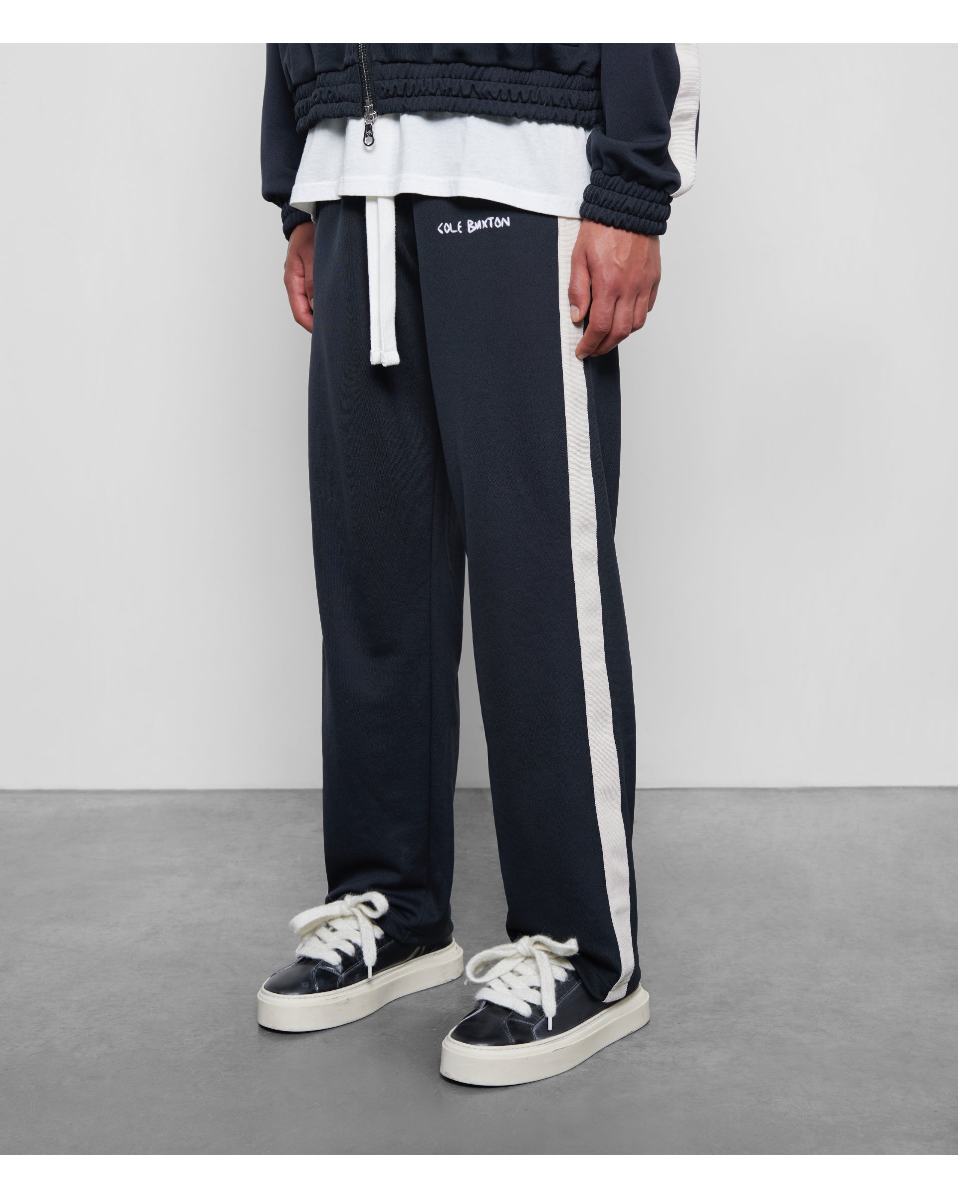 Embroidered track pants sale